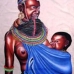 A Turkana woman with a baby suckling
