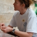 Maile Black examines a coffee bean